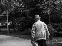 grayscale-back-view-photo-of-elderly-man-with-cane-walking-2586537