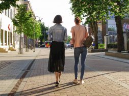 photo-of-women-walking-down-the-street-1116984