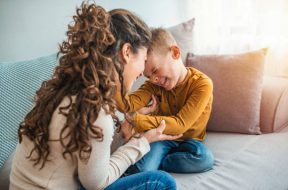 The kind of love that can't be described, only felt. Mother and her child, tickling, kidding and having fun in the couch, with spontaneous smiles. Loving my son