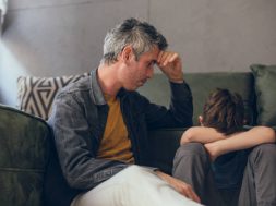 Caring dad talk with little son showing love and support