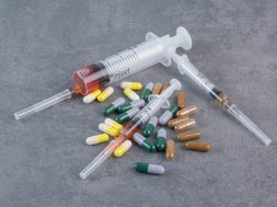 Assorted pharmaceutical capsules and syringes with serums. High quality photo