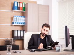 Businessman working in his office. Businessperson in professional environment